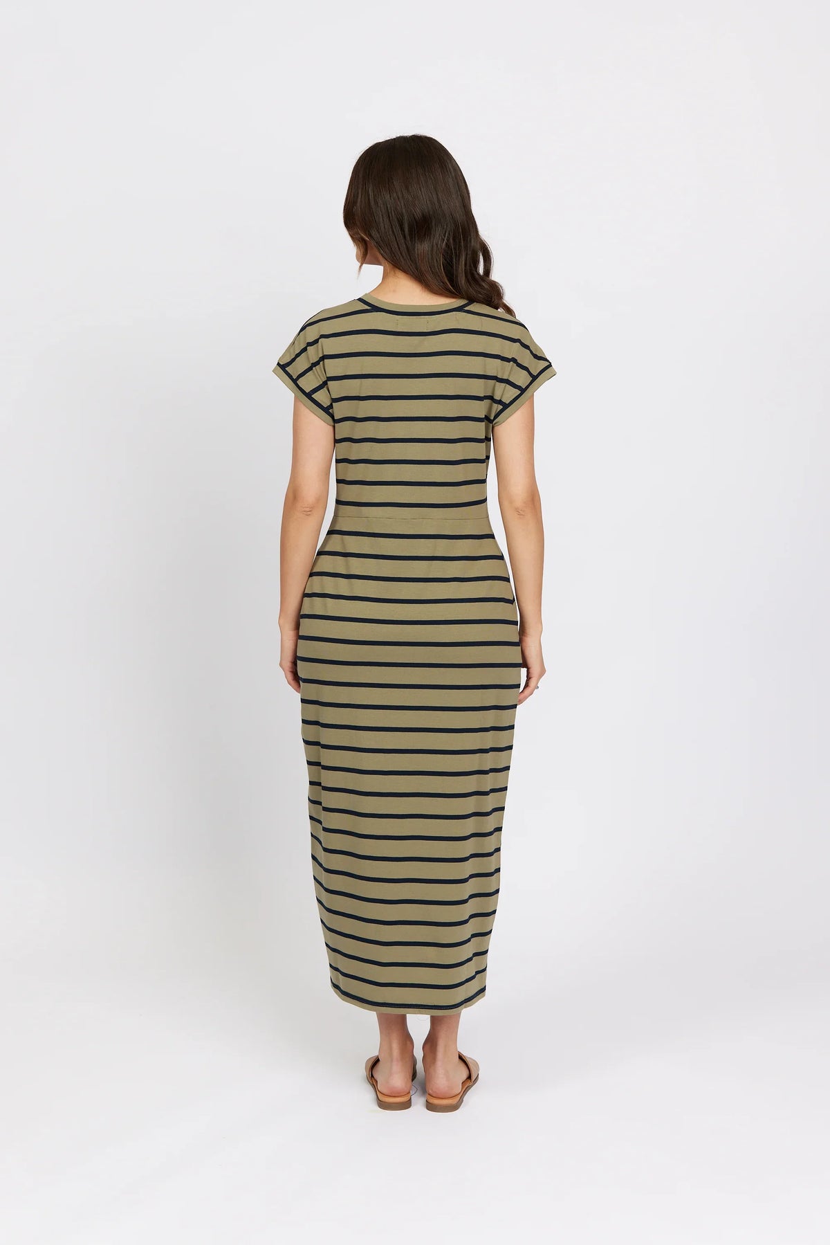Woman wearing a khaki stripe midi dress, short sleeves, back view, casual fashion.