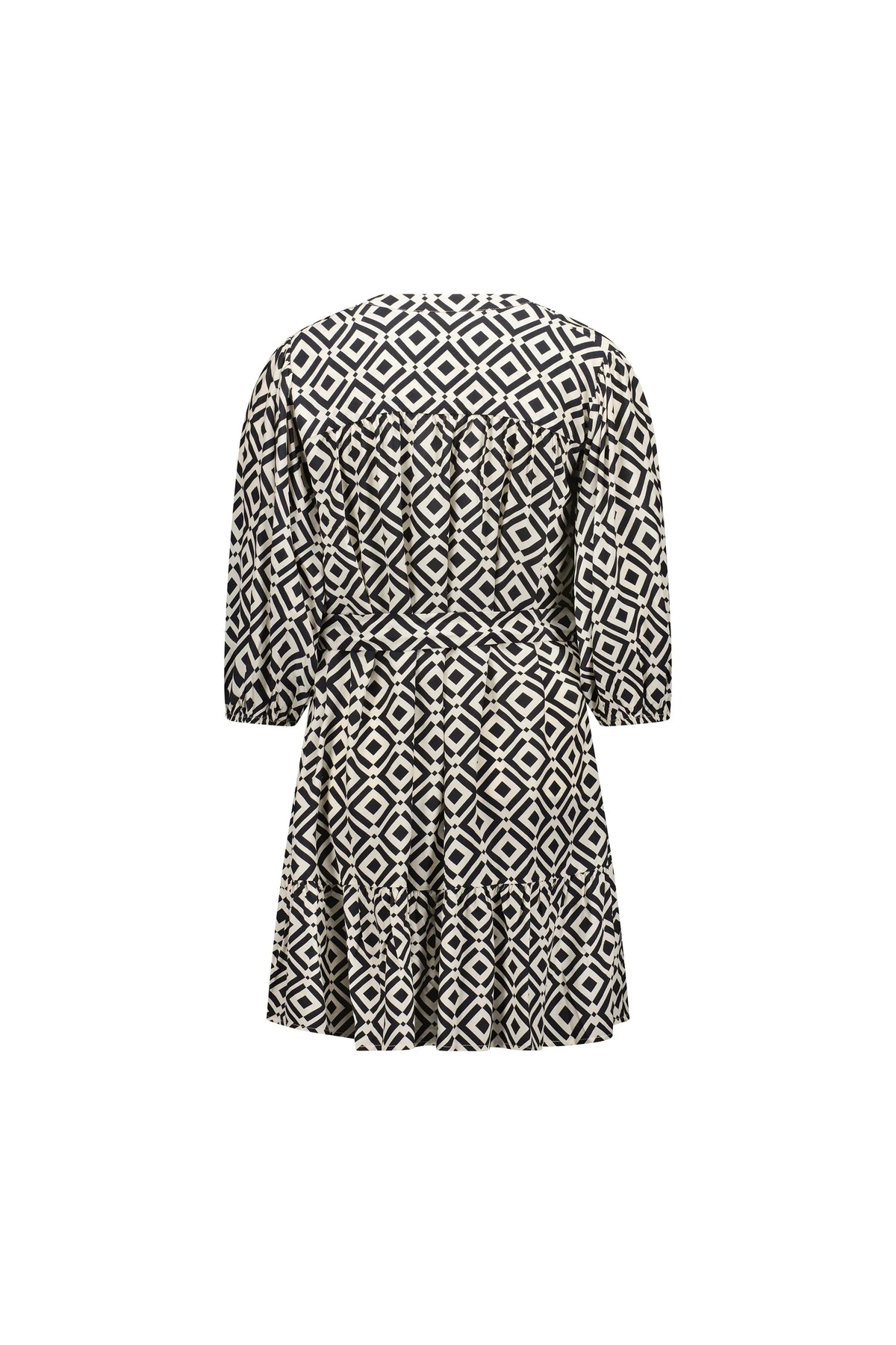 Back view of a black and white geometric patterned short dress with half sleeves