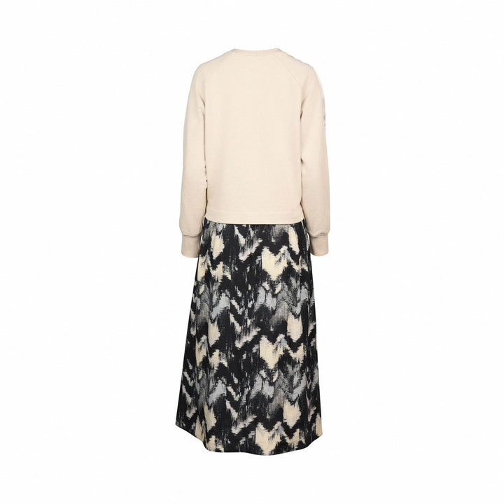 Back view of long sleeve stone top with abstract black and cream midi skirt dress