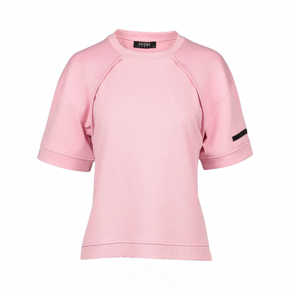 Light pink short sleeve women's tee with black arm detail and relaxed fit on white background
