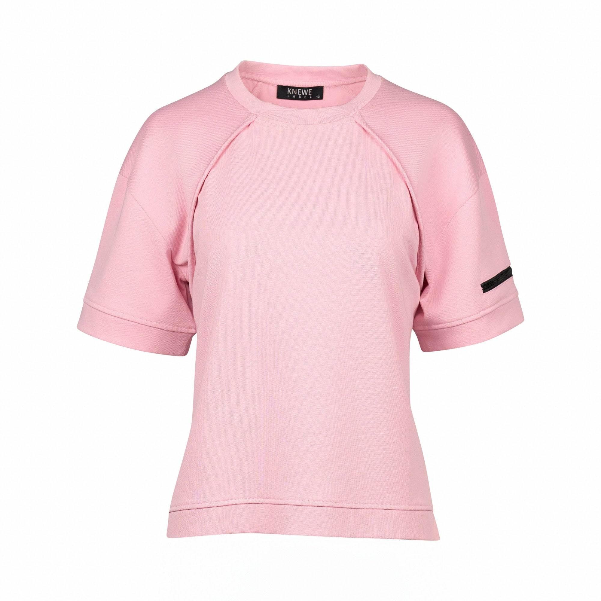 Light pink short sleeve women's tee with black arm detail and relaxed fit on white background