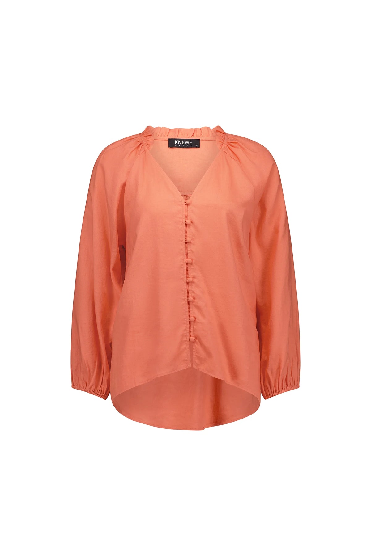 Coral long sleeve blouse with button front and ruffle collar, relaxed fit, on white background