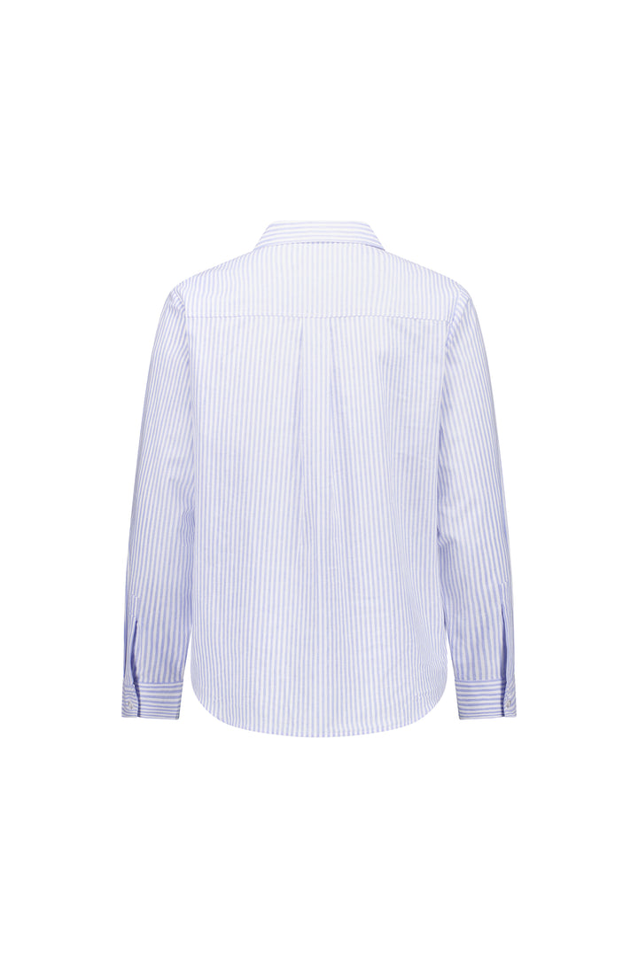 The Knewe Label Tide Shirt - Blue Stripe features light blue and white vertical stripes, long sleeves, collar, and buttoned cuffs. Made from lightweight cotton, it’s ideal for effortless everyday style. Shown from the back.