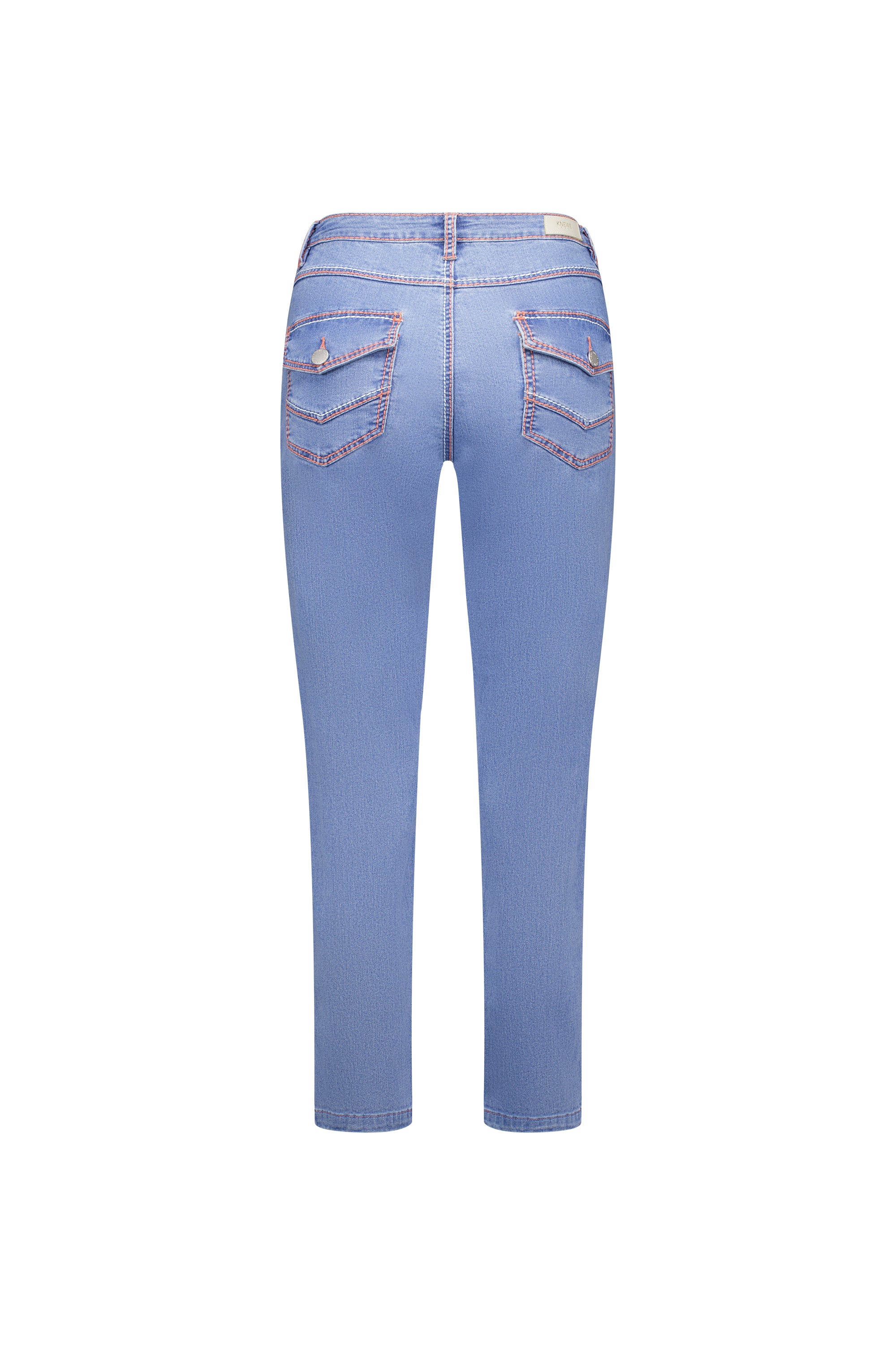 Flat lay back view of the Knewe Label Switch Jean in palm blue stretch denim, showing the straight-leg ankle-grazer cut, flap back pockets with metal button closures, contrast stitching and leather KNEWE brand patch on the waistband.