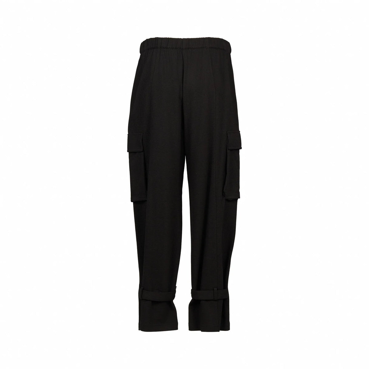 Back view of black cargo pants with elastic waistband and side pockets on white background