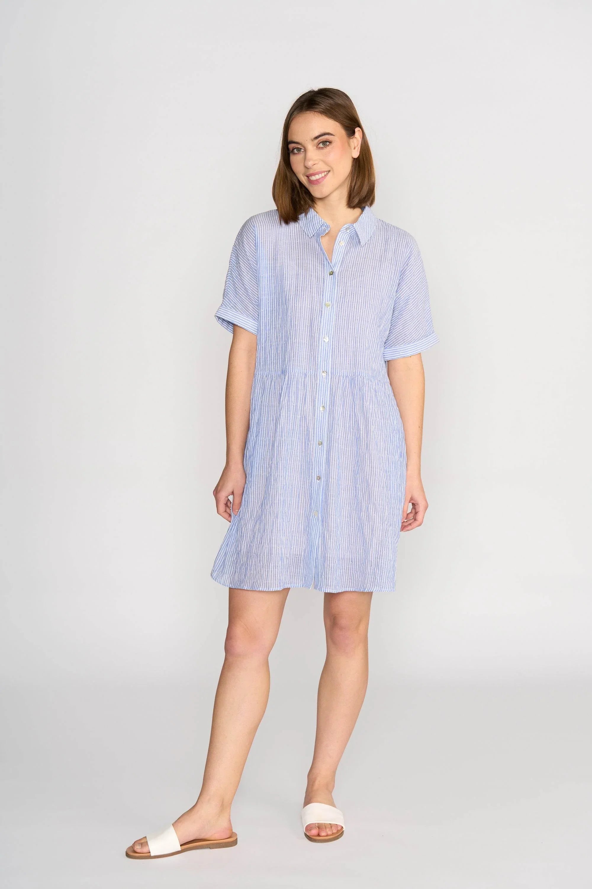 Woman wearing blue and white striped button-up short sleeve cocoon dress